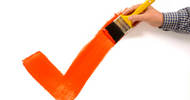 Man painting red tick