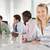 Four businesspeople in a boardroom smiling Monkey Business Images Four businesspeople in a boardroom smiling