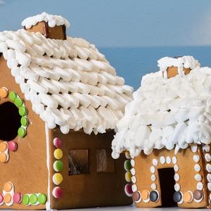 God jul illustrert med et pepperkakehus