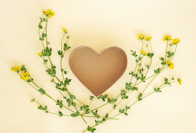 Creative layout made of flowers and leaves with heart shaped gif