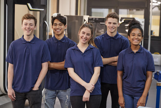 Portrait Of Engineering Apprentices In Factory