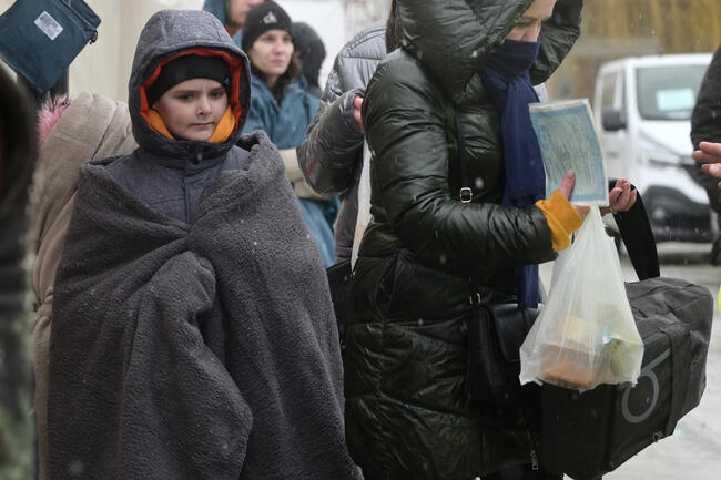 Isaccea, Romania. 02 March, 2022. Refugee Ukrainians walk from U