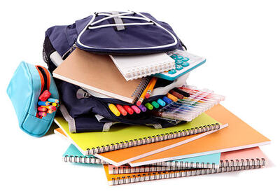 Blue backpack overflowing with various school supplies.  Alternative version with orange backpack: