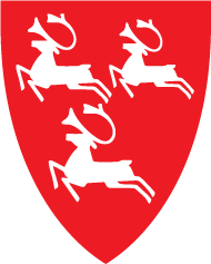 Kommunevåpen Porsanger kommune, tre springende rein på rød bakgrunn